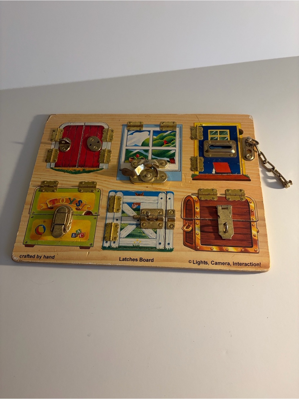 Melissa & Doug Wooden Latches Board - Red, Blue, Yellow, Green, Brown